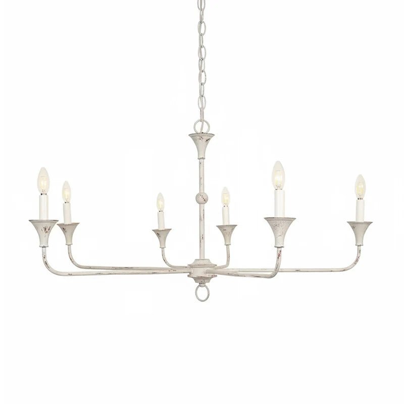 Candle chandelier shown in a styled entryway