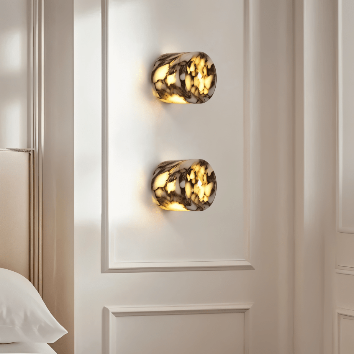 Clérachic veined stone wall light lit warm in a dim room