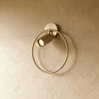Clérachic brass ring wall light, an open circle with a small head aiming light downward