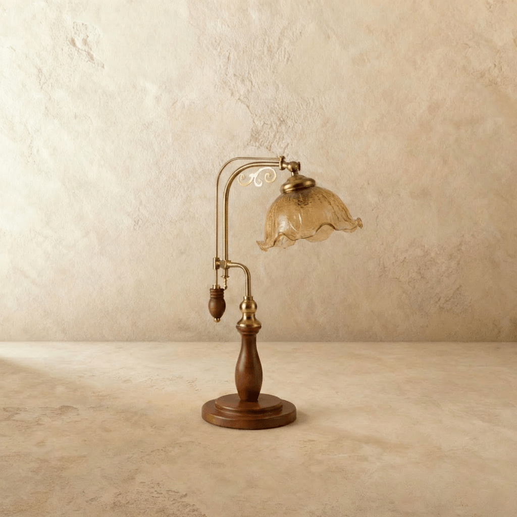 Clérachic table lamp in amber glass, the fluted shade and adjustable brass arm shown from another angle.