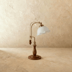 Clérachic table lamp in milky glass, the ruffled shade and adjustable brass arm shown from another angle.