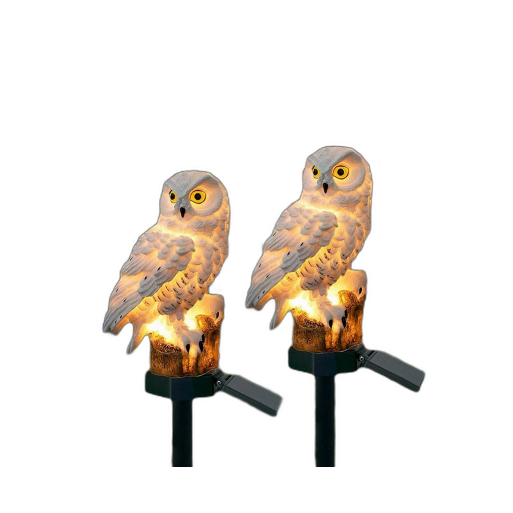 Solar owl garden pathway light on its ground stake, shown on a white background