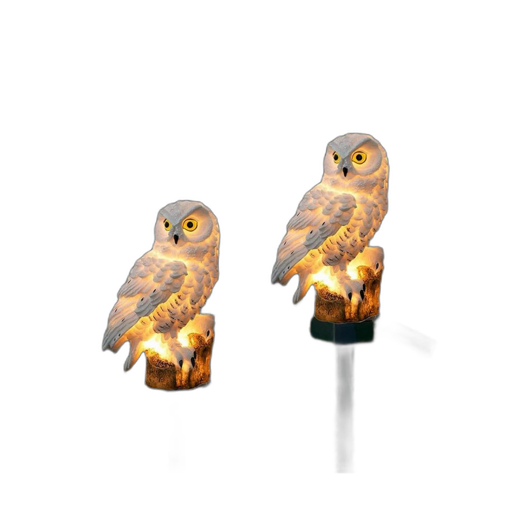 Detail of the solar owl light's textured resin feathers and solar panel top