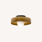 A dark mounting plate crowns this Clérachic ceiling light in warm brown glass, unlit against a pale backdrop.