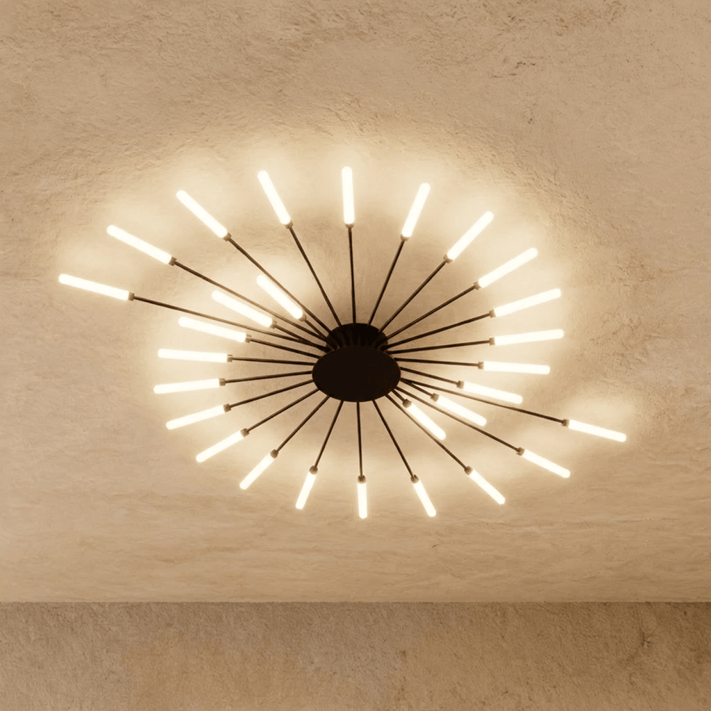 Clérachic starburst chandelier in black, arms of graded lengths sweeping the burst into a comma with an open centre.