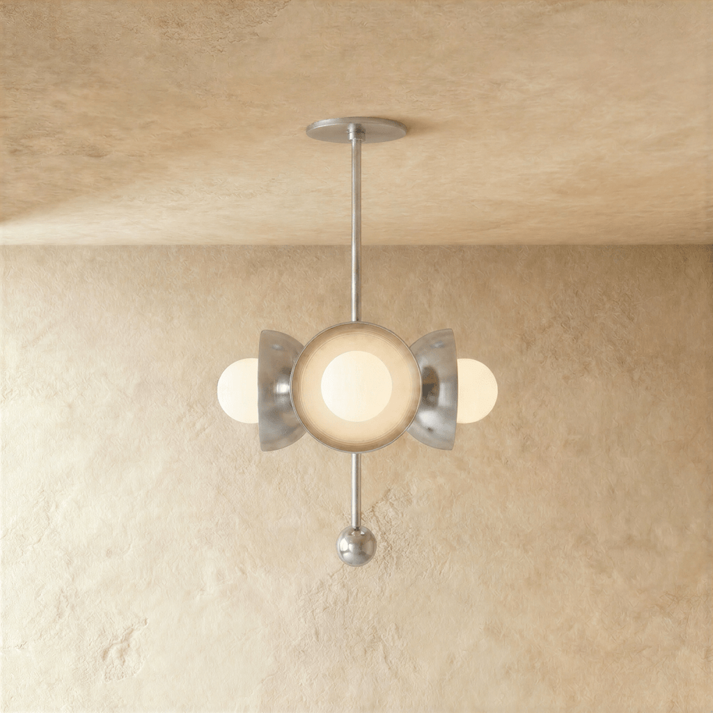 Clérachic disc-and-globe pendant light in chrome, hung from a plaster ceiling and photographed in studio.