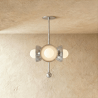 Clérachic disc-and-globe pendant light in chrome, hung from a plaster ceiling and photographed in studio.