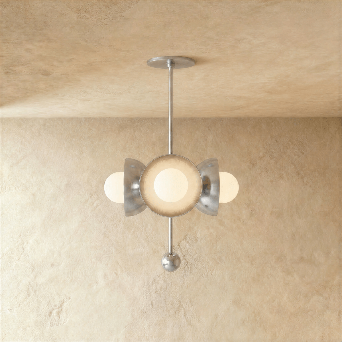 Clérachic disc-and-globe pendant light in chrome, hung from a plaster ceiling and photographed in studio.