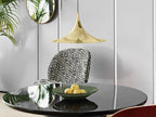 Arch pendant light shown in a warm styled interior