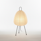 Minimalist tripod rice paper table lamp shown lit from the front