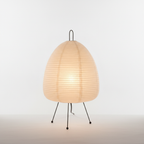 The lit rice paper lamp showing its even, warm ambient light