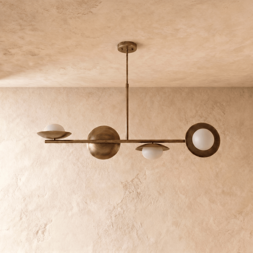 Clérachic pendant light in vintage brass, the linear brass bar and glass globes shown from a slightly wider angle.