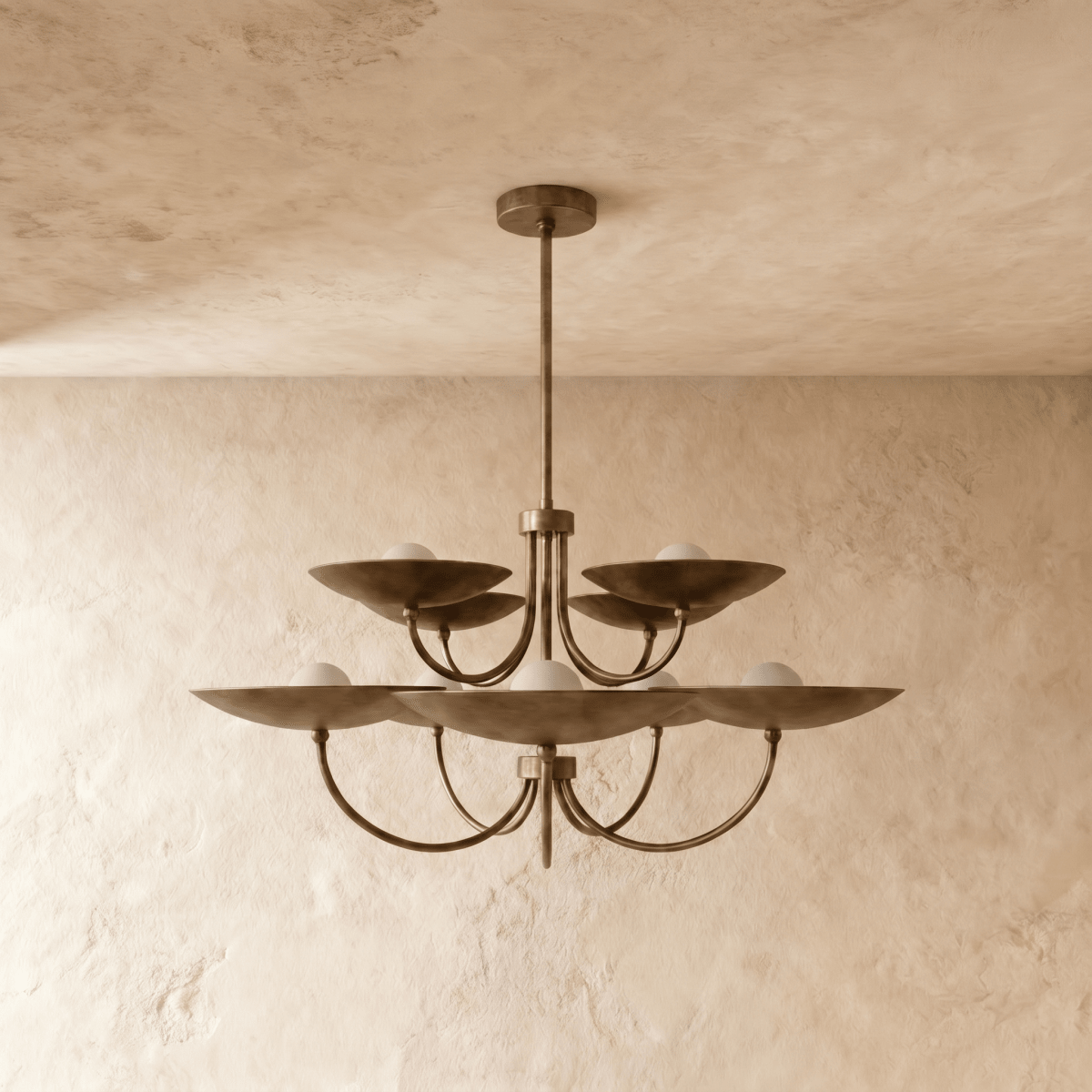 Clérachic two-tier disc chandelier in vintage brass, shown from a slightly closer studio angle overhead.