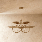 Clérachic two-tier disc chandelier in polished brass, shown from a slightly closer studio angle overhead.