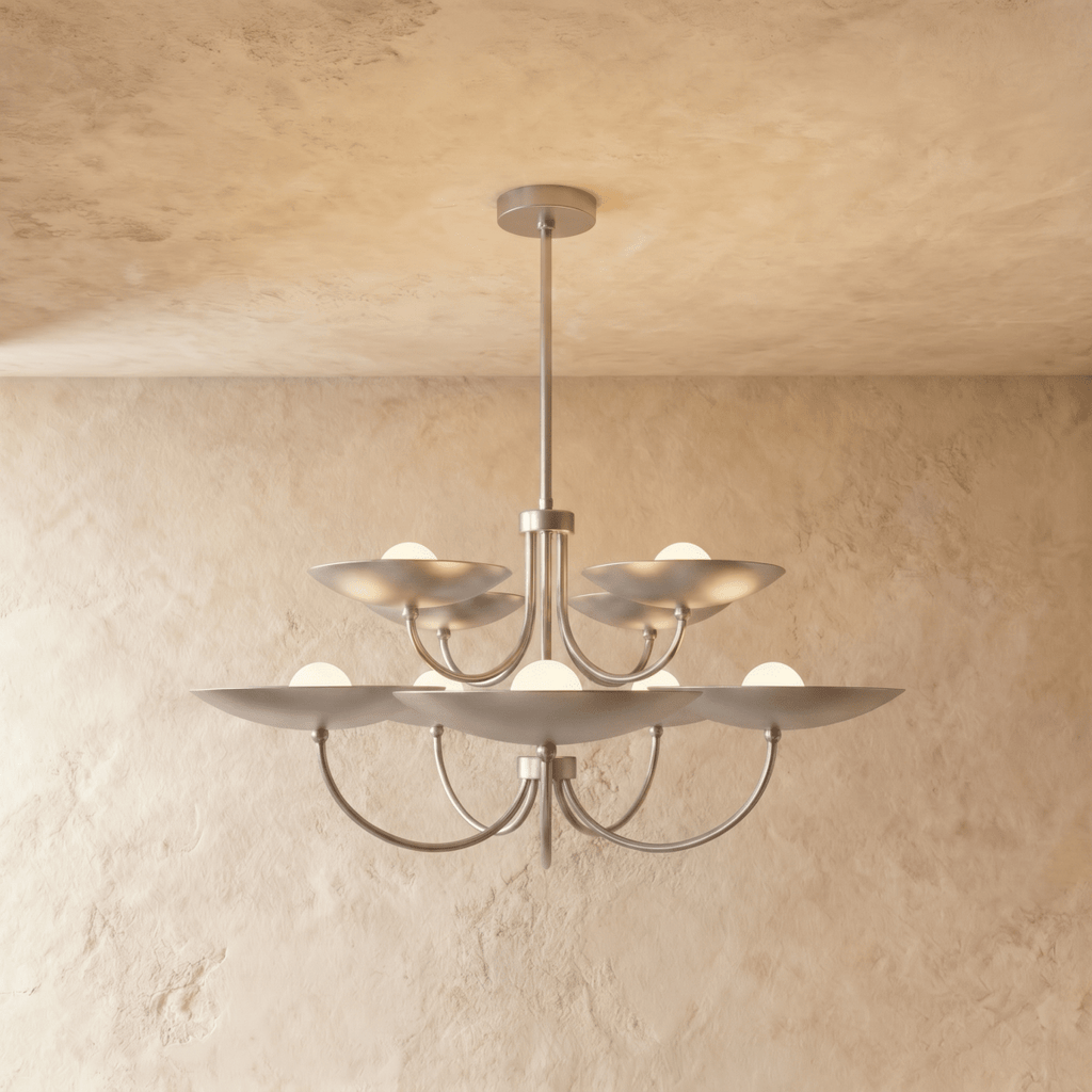 Clérachic two-tier disc chandelier in chrome with curved arms, hung from a plaster ceiling in studio light.