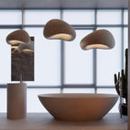 Wabi-sabi organic chandelier shown lit in a large interior