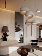 Wabi-sabi organic chandelier with layered organic shades in soft light