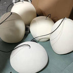 Wabi-sabi organic chandelier with sculptural forms casting shadows