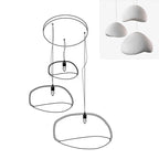 Wabi-sabi organic chandelier with layered shades over a room