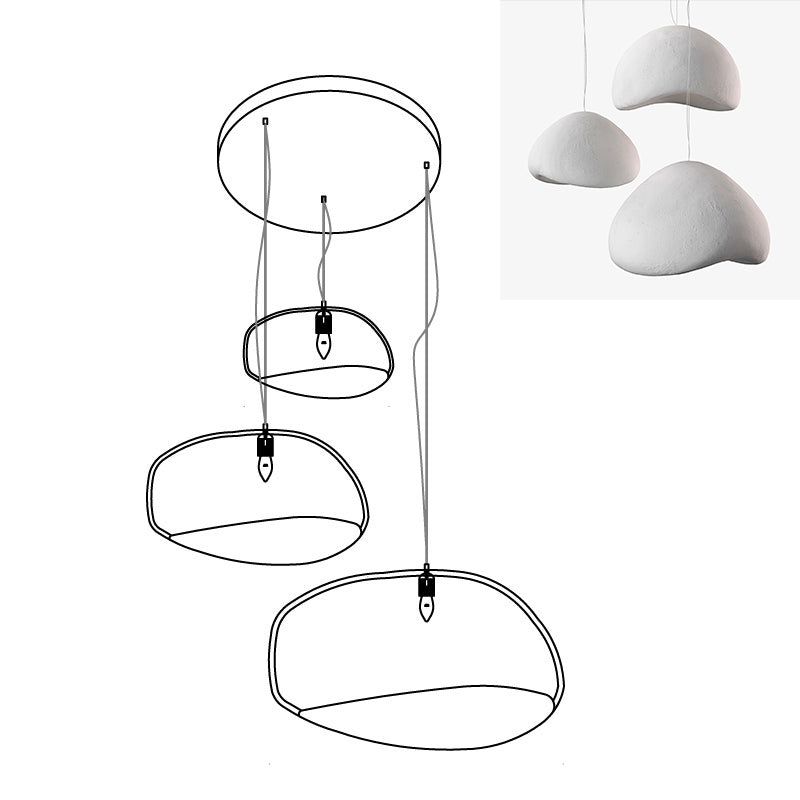 Wabi-sabi organic chandelier with layered shades over a room