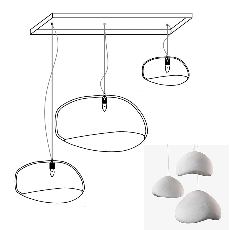 Wabi-sabi organic chandelier with organic shades in warm light