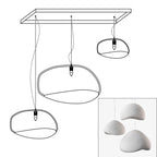 Wabi-sabi organic chandelier with organic shades in warm light