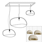 Wabi-sabi organic chandelier shown over an open living space