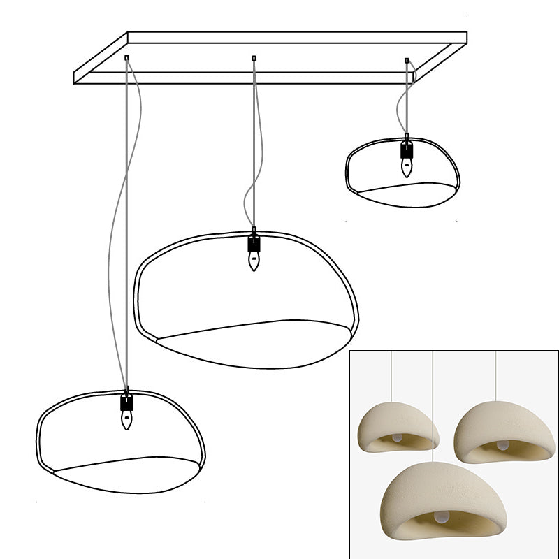 Wabi-sabi organic chandelier shown over an open living space
