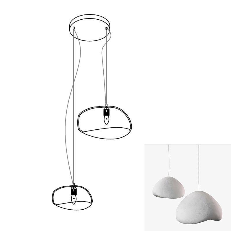 Wabi-sabi organic chandelier combination glowing in an interior