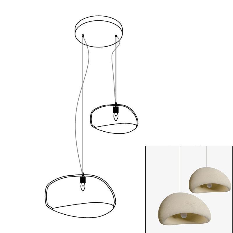 Wabi-sabi organic chandelier with sculptural shades in warm light
