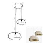 Wabi-sabi organic chandelier with sculptural shades in warm light
