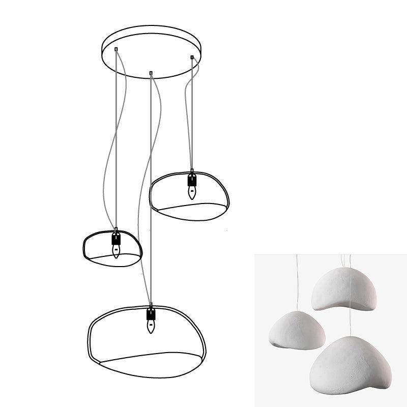 Wabi-sabi organic chandelier with organic forms casting shadows