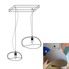 Wabi-sabi organic chandelier glowing over a seating group