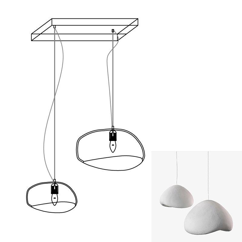 Wabi-sabi organic chandelier shown in a large open interior