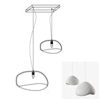 Wabi-sabi organic chandelier with layered shades at varied heights
