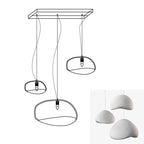 Wabi-sabi organic chandelier with sculptural HDPE forms lit warmly