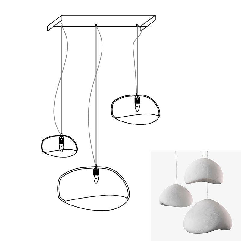 Wabi-sabi organic chandelier with sculptural HDPE forms lit warmly