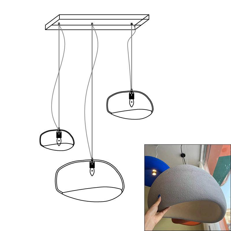 Wabi-sabi organic chandelier with organic shades in soft light