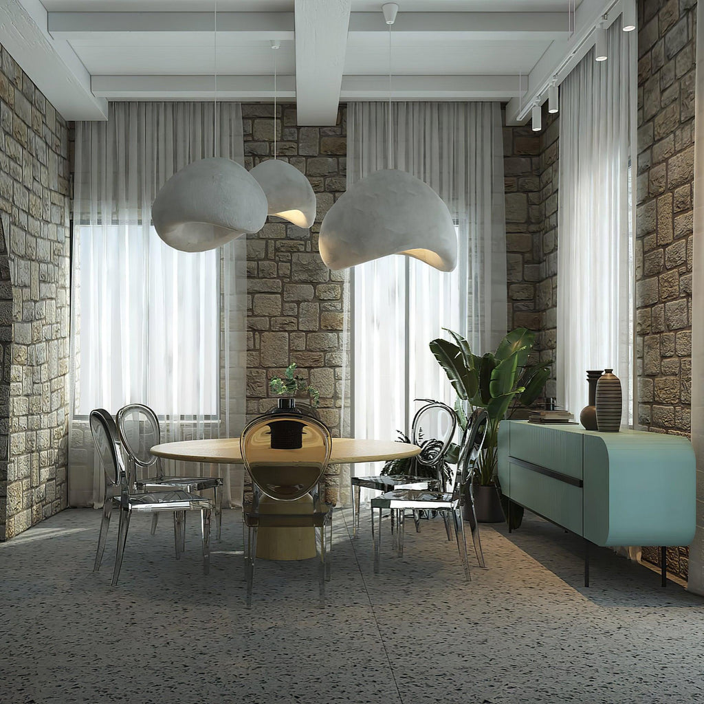 Wabi-sabi organic chandelier with combined organic forms lit warmly