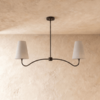 Clérachic double-arm chandelier in matte black, the curved arms and cone shades viewed from another angle.
