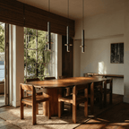 Clérachic travertine pendant hanging unlit against a limewash wall