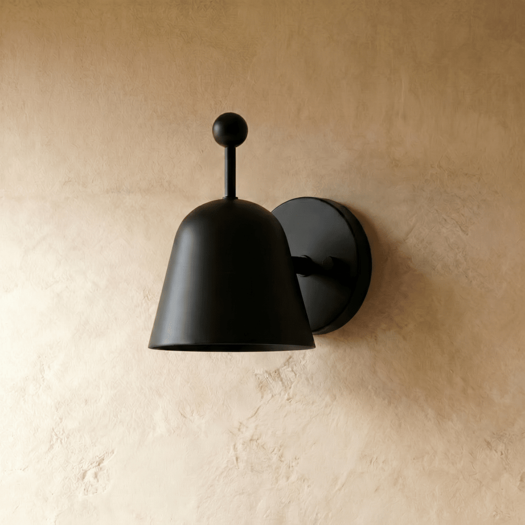 This black Clérachic wall lamp is shown from another angle, its ball finial and shade both matte.
