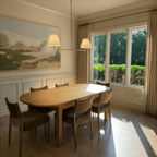 Clérachic chandelier in vintage brass above a sunlit dining table beside a framed landscape painting.