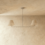 Clérachic chandelier in chrome viewed close, the central rod dropping to a paired light bar.