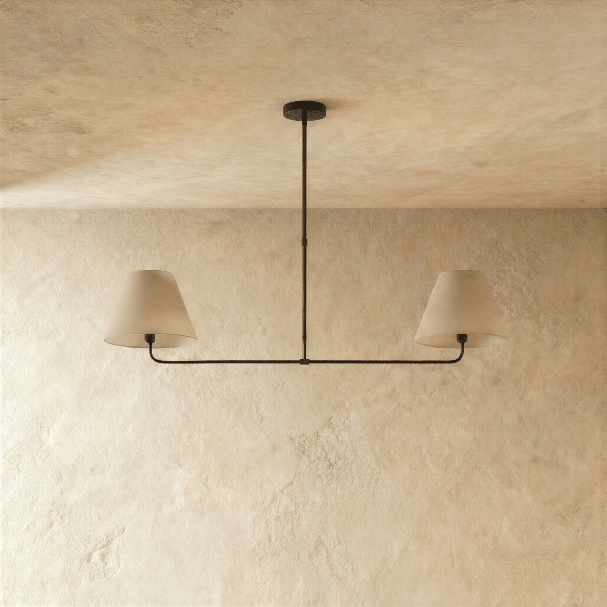 Clérachic chandelier in matte black shown from another angle, light glowing beneath both shades.