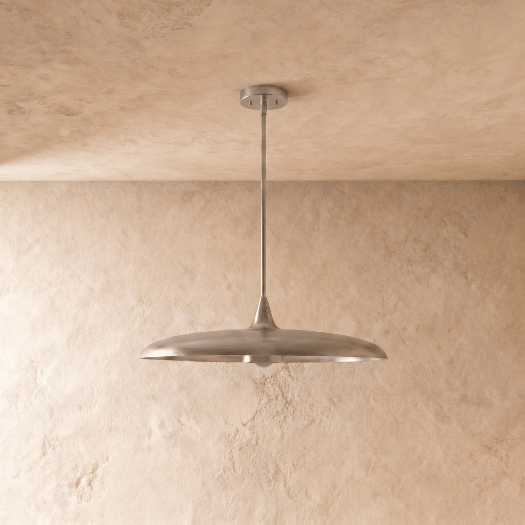 Clérachic pendant light in chrome, the saucer shade and slender rod shown from a slightly different angle.