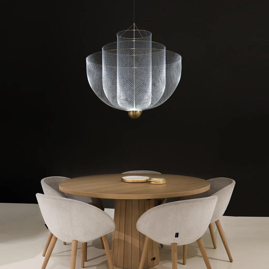 Wirework pendant light casting dramatic shadows on the ceiling
