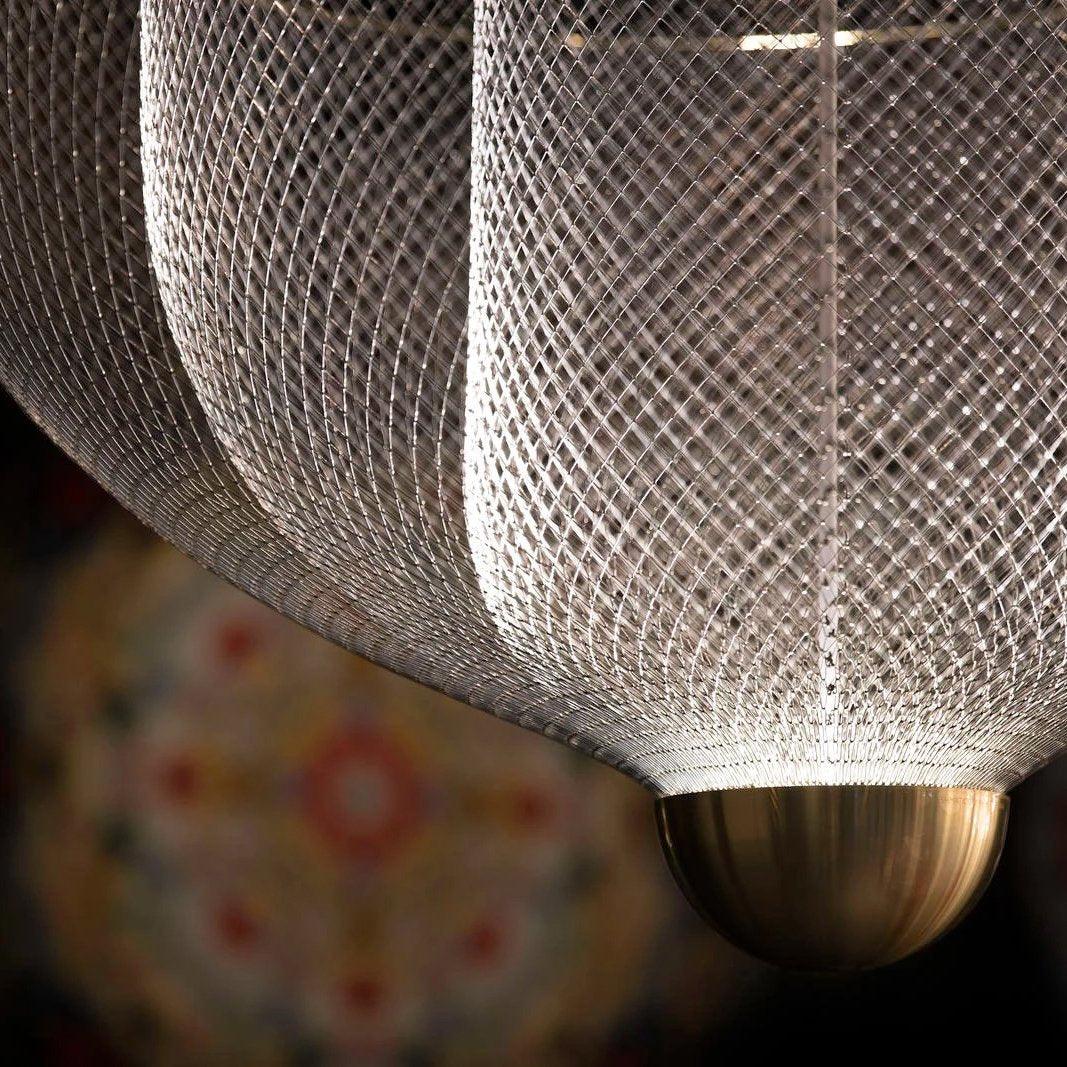 Steel wire pendant light casting layered shadows around it