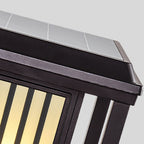 Close-up of a solar panel on a roof with a clear sky background
