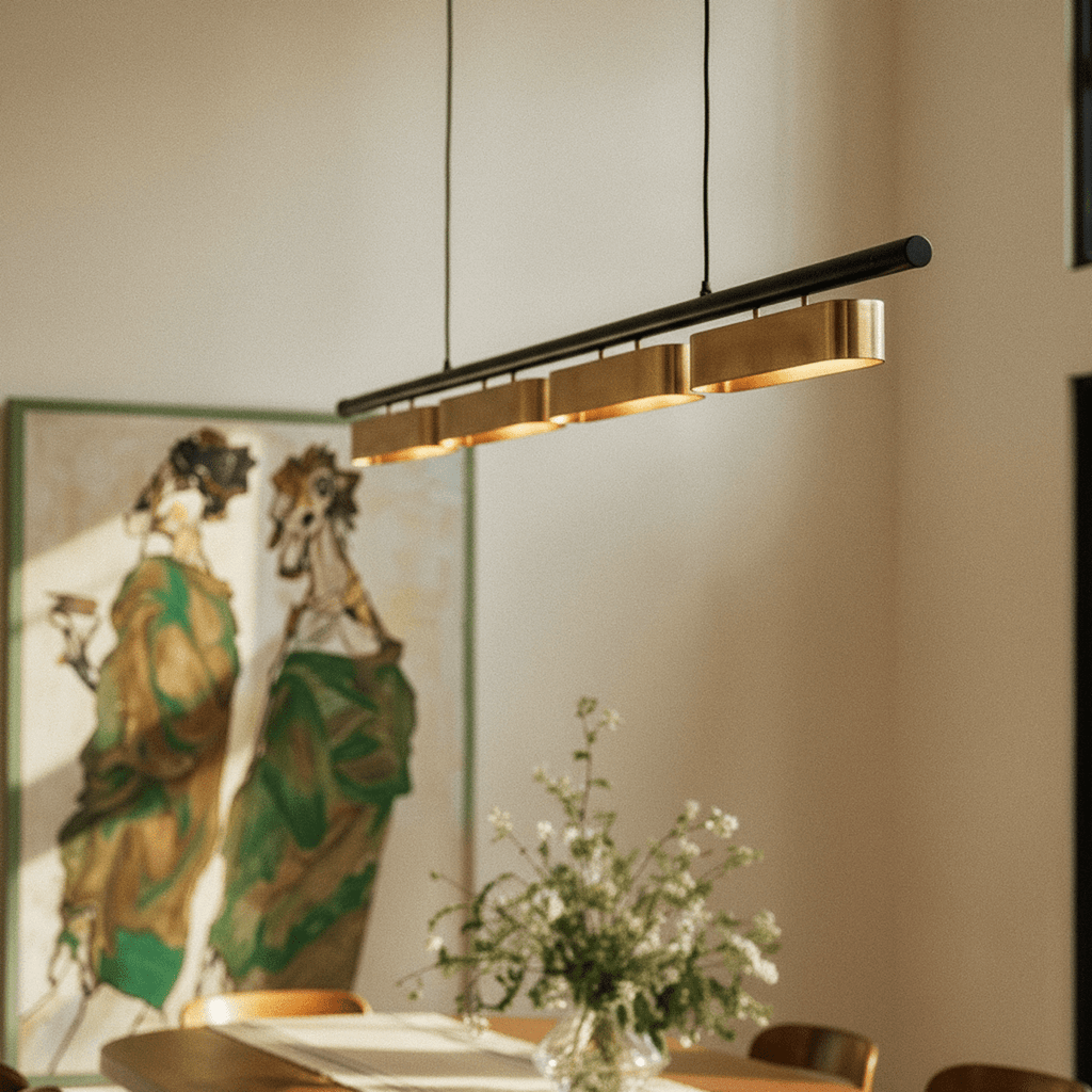 Clérachic linear chandelier with four lit shades, viewed from below on its two black cables beside a large framed painting.